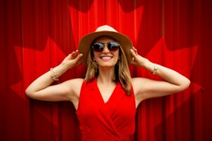 Photo by Andre Furtado: https://www.pexels.com/photo/woman-in-red-sleeveless-dress-with-canada-flag-printed-background-1267369/